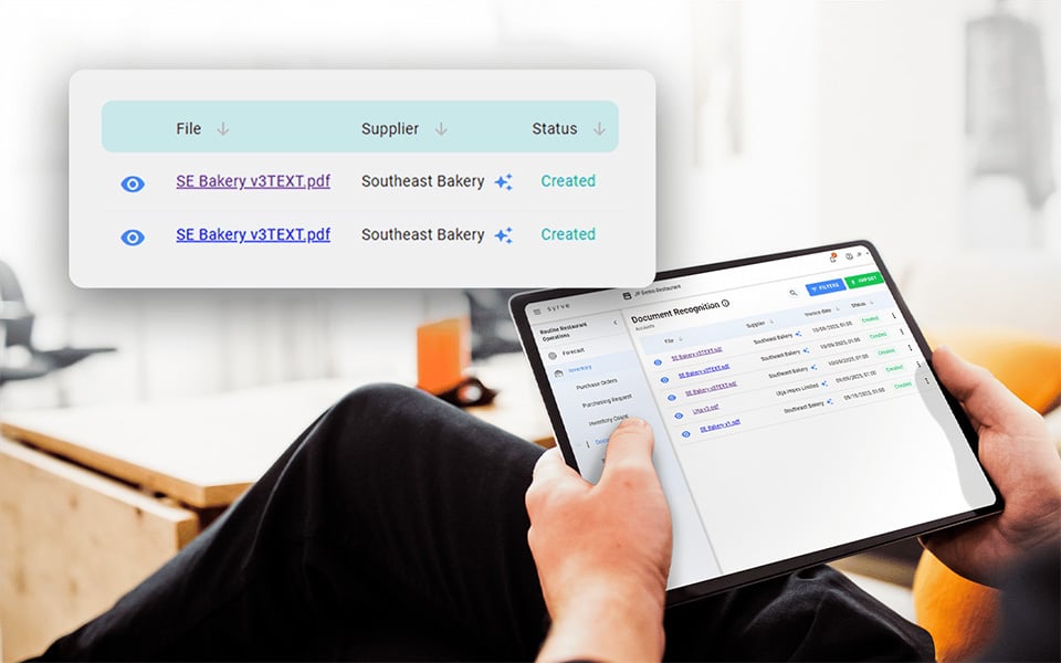 Restaurant owner using AI invoice scanning software to manage suppliers