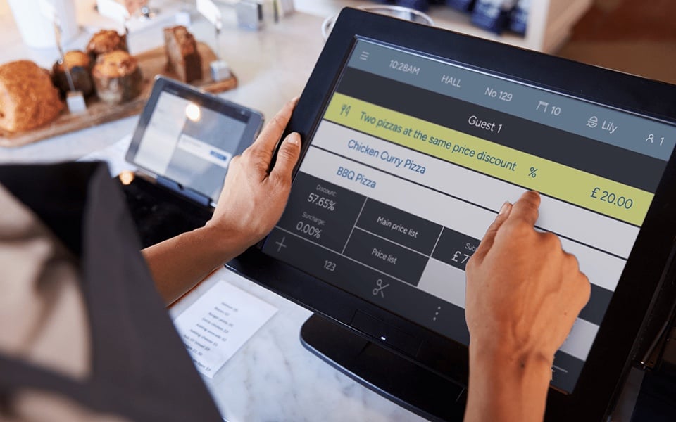 Waiter applying discounts via POS system