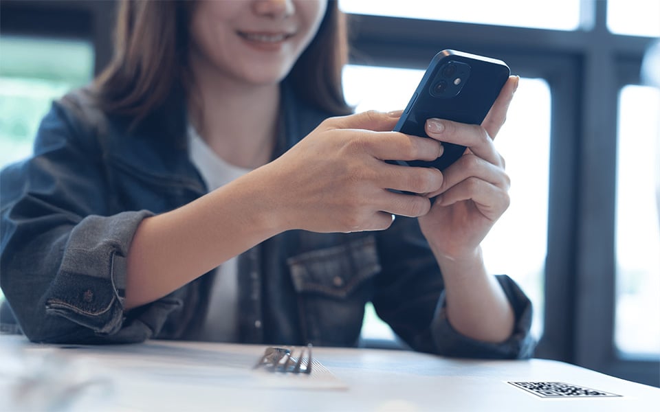 Customer browsing digital menu via mobile app