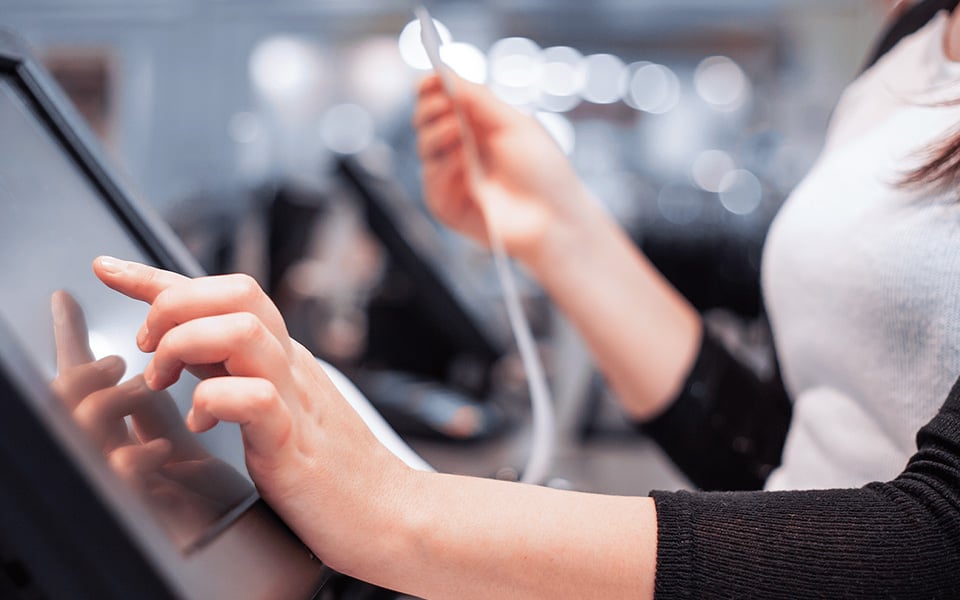 Restaurant staff using POS system to process orders and payments in real time