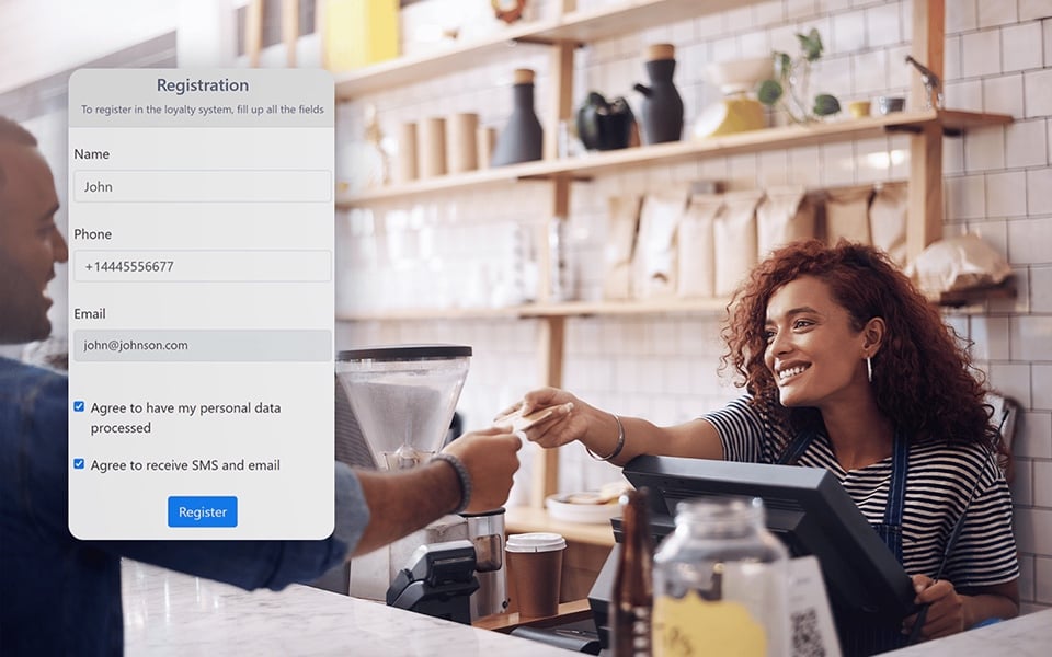 Restaurant staff registering customer in loyalty and rewards system at POS counter