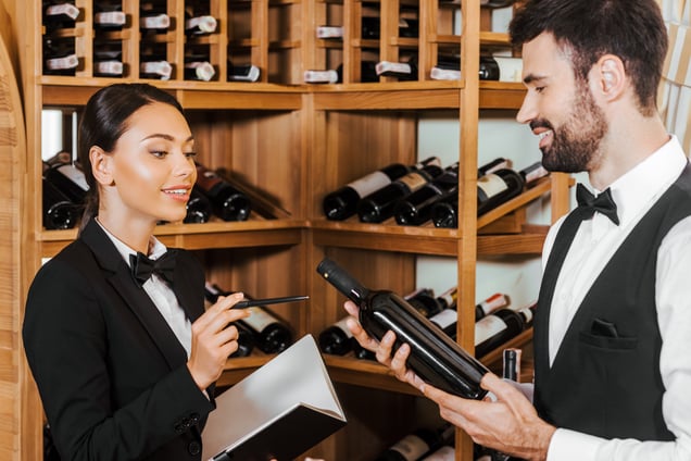 couple-of-young-wine-stewards-doing-stocktaking-of-2023-11-27-05-22-51-utc
