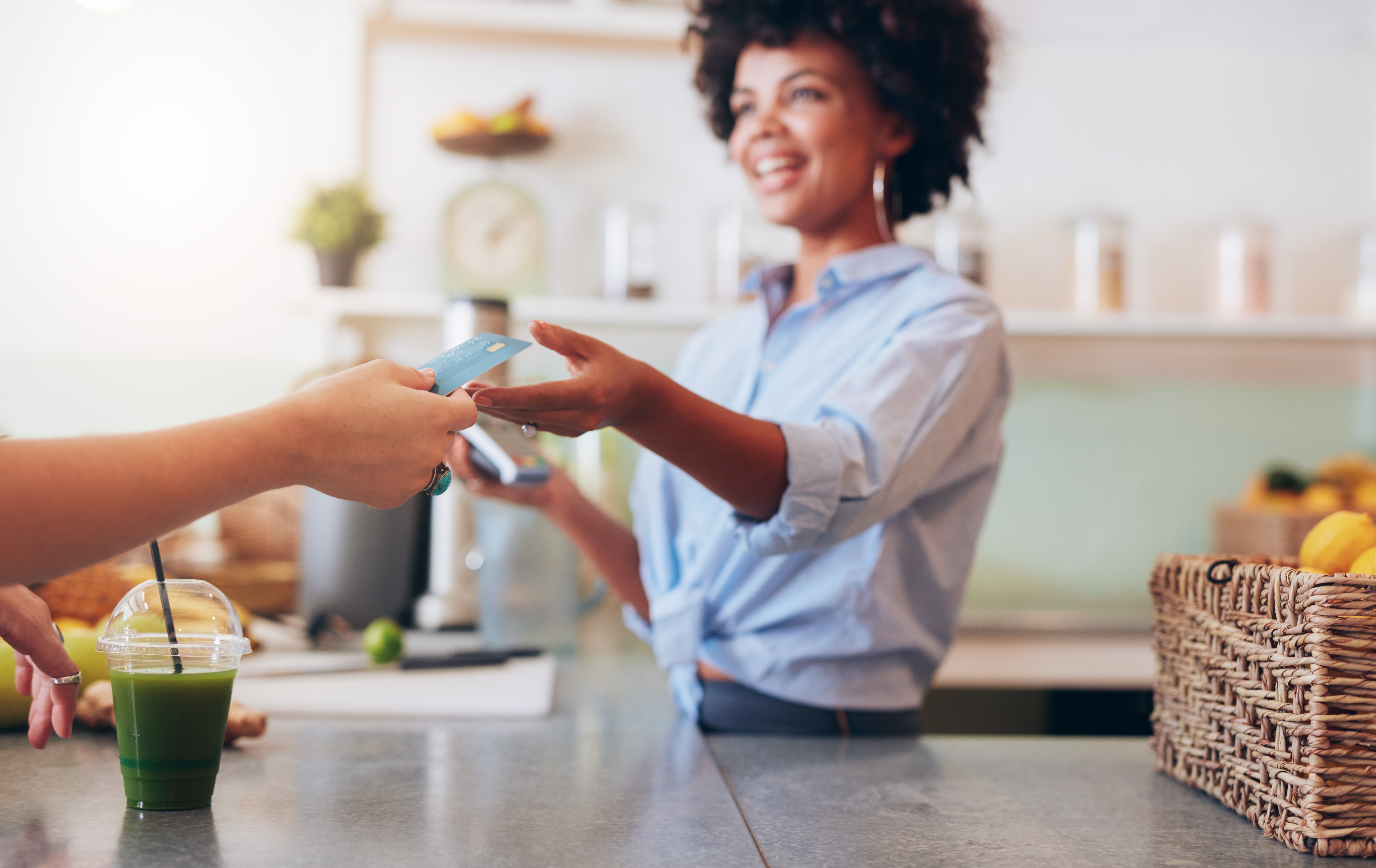 female-employee-taking-payment-from-customer-2023-11-27-05-21-13-utc