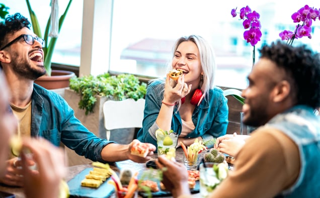 multicultural-friends-eating-together-at-luxury-pu-2023-11-27-05-18-54-utc