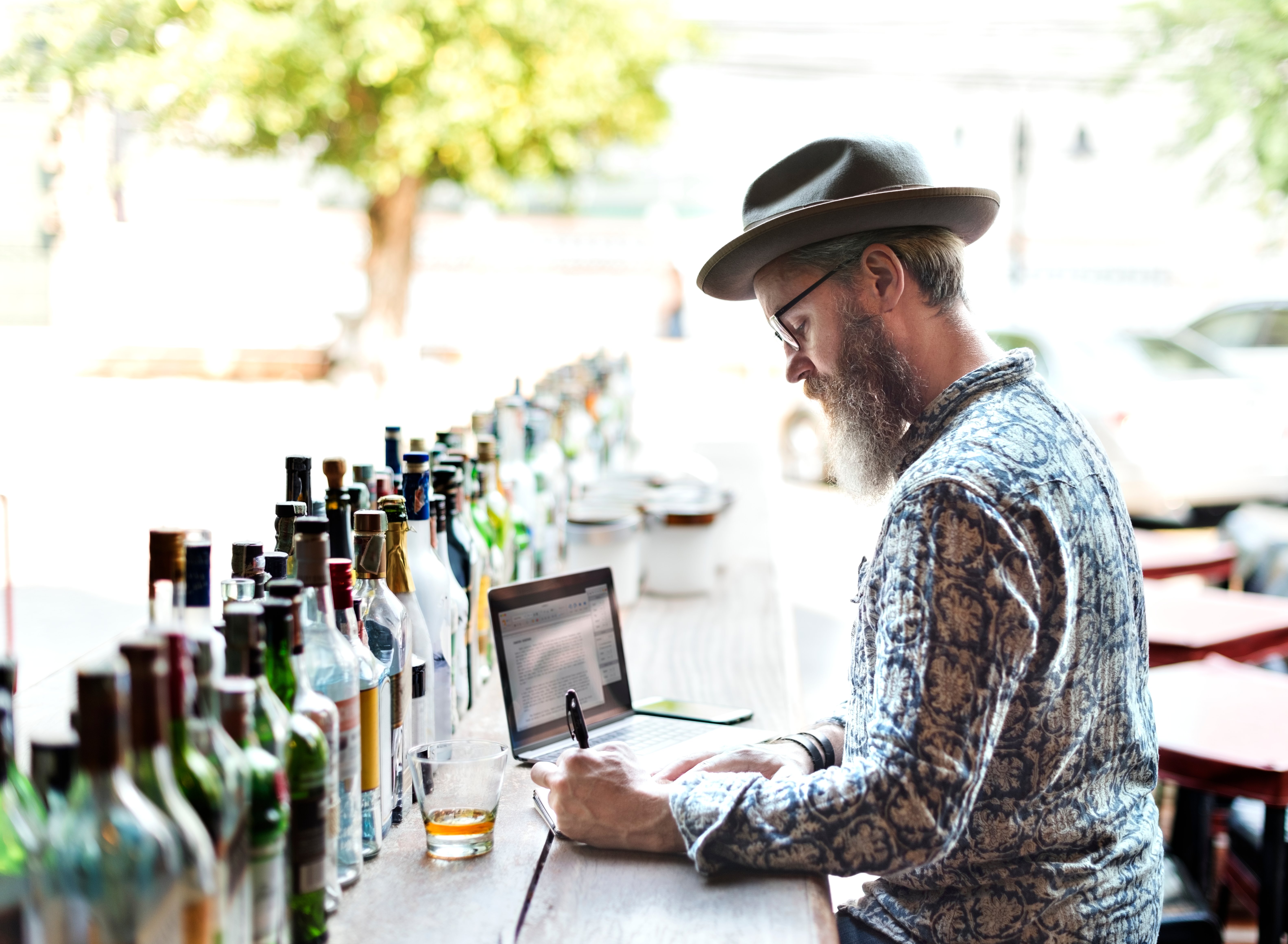 restaurant-owner-doing-inventory-in-the-bar-2023-11-27-04-58-41-utc
